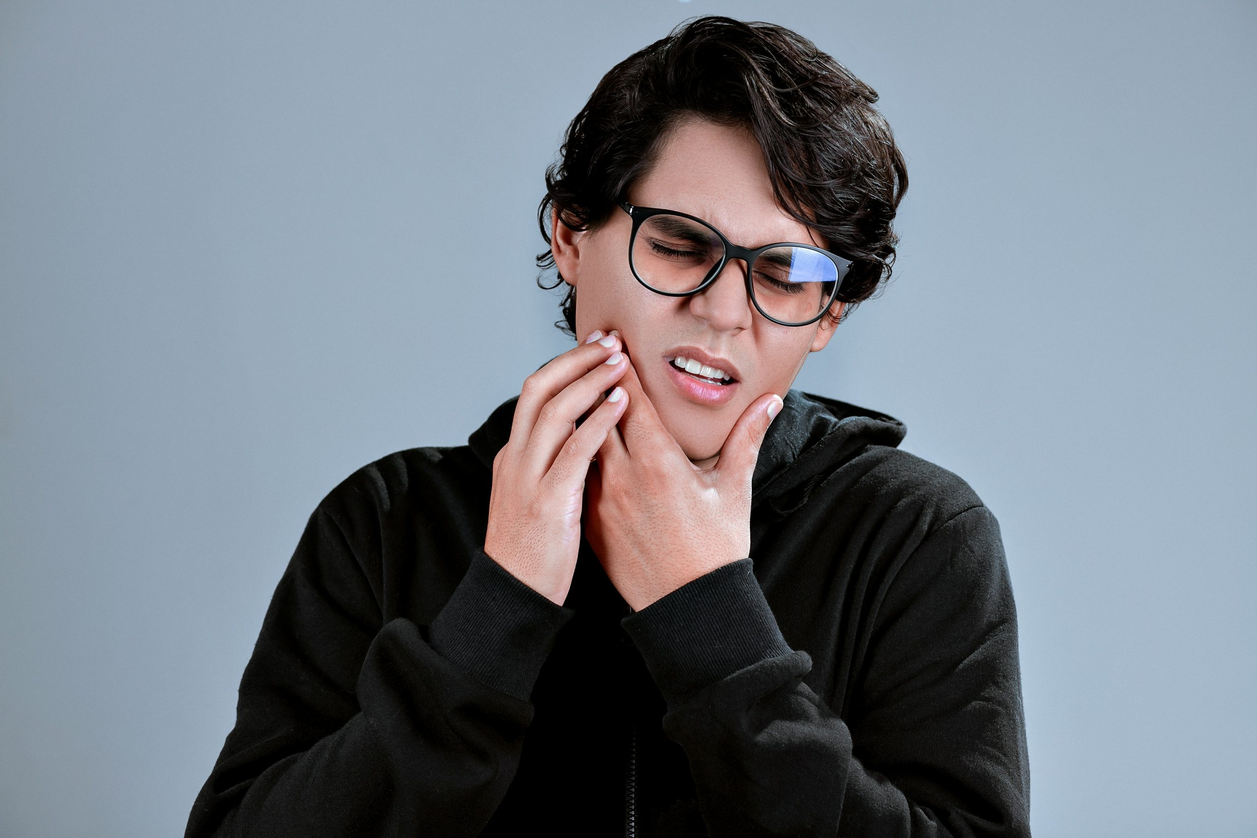 man experiencing tooth pain
