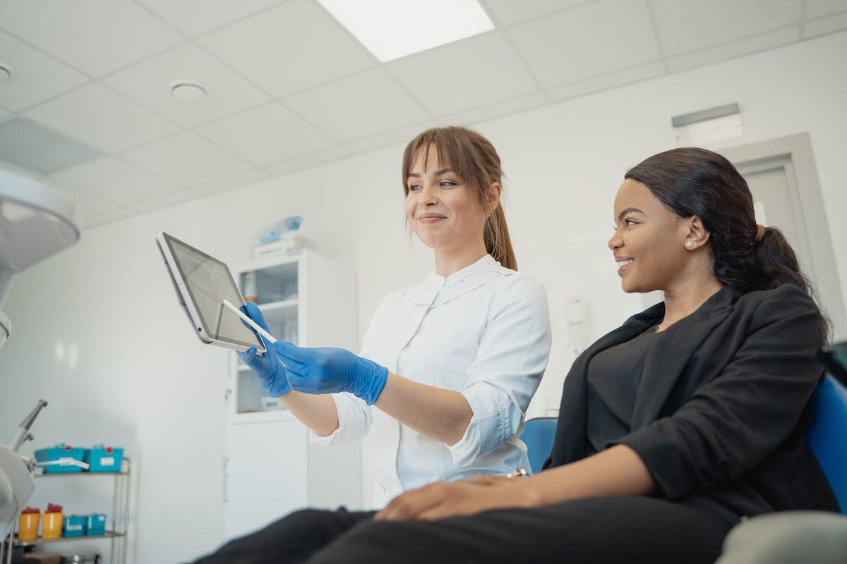 dentist talking to her patient